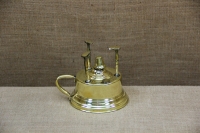 Antique Brass Camping Stove First Depiction